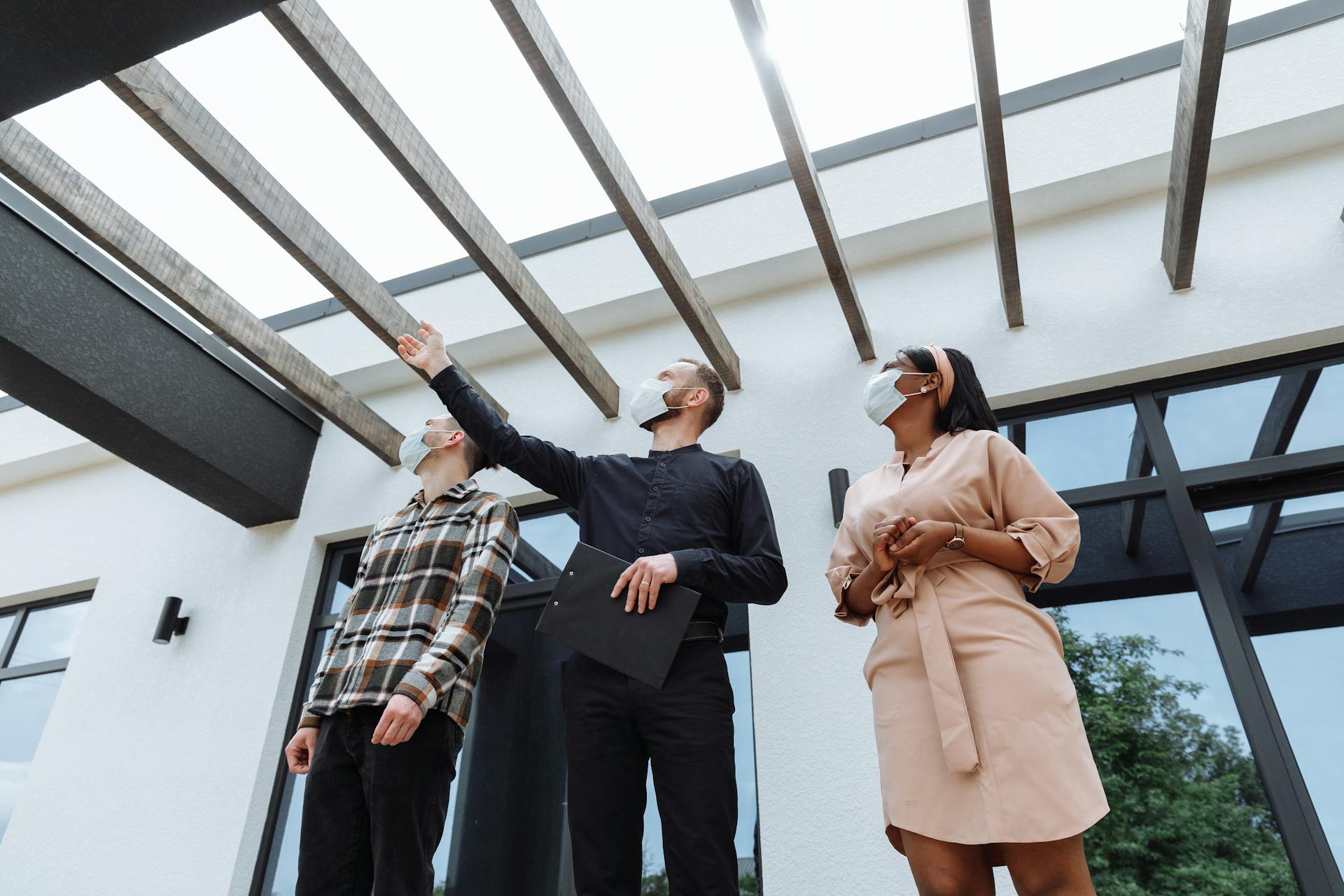 Real Estate Agent showing the House to Clients