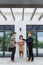 A Real Estate Agent Handing Out the Keys to the Client