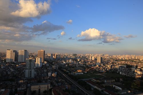 Free Aerial view of cityscape with skyscrapers and blue sky during sunset. Stock Photo