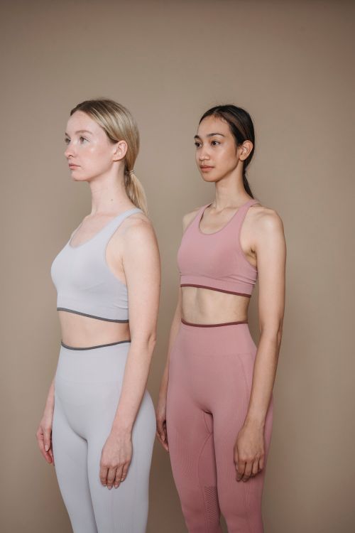Two models wearing coordinated activewear sets