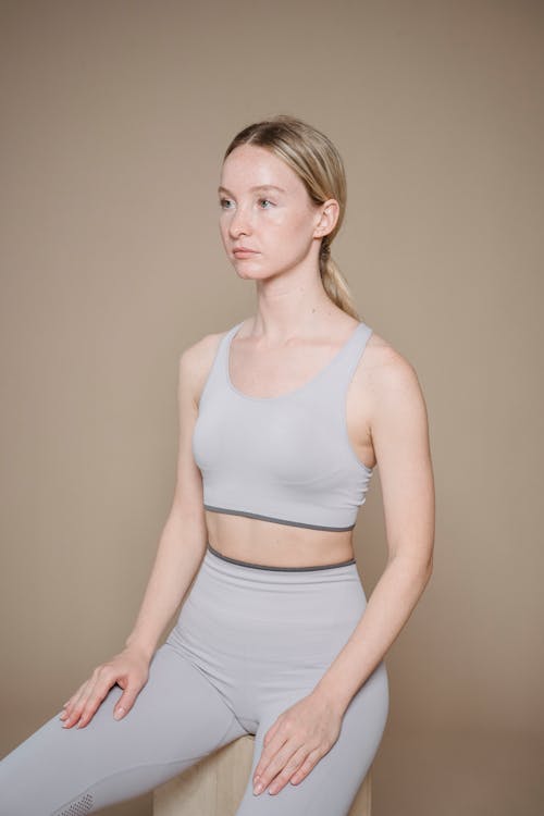 Photo of a Woman in Gray Activewear Clothes