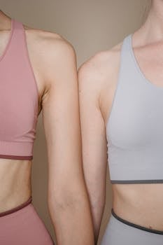 A detailed shot of two women wearing sports bras, showcasing fitness fashion.