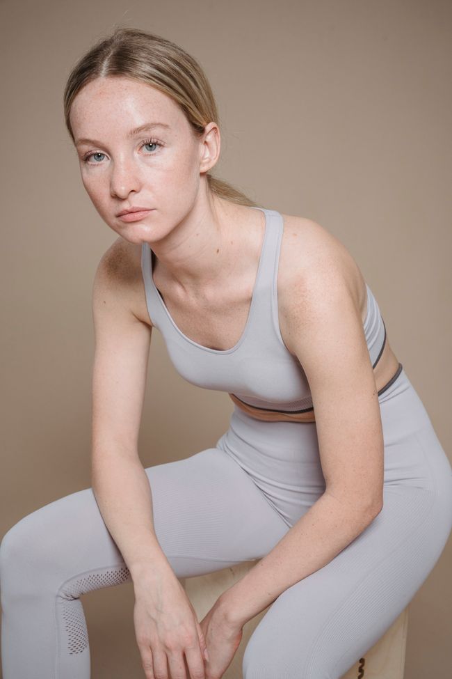 Close-up of a light grey seamless bra and legging set — photo by Sasha Kim on Pexels