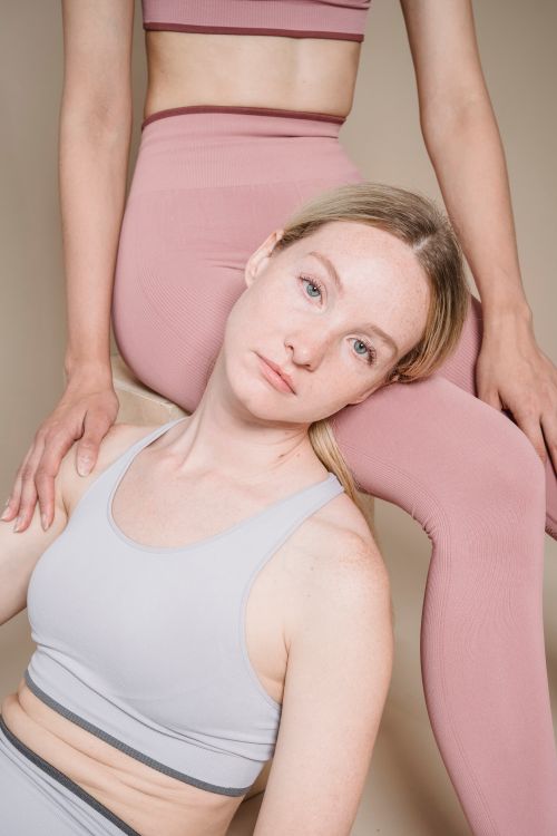 Free Two women posed in stylish activewear, showcasing modern and minimalist fashion. Stock Photo