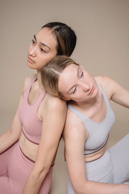 Free A Woman Leaning on another Woman's Shoulder Stock Photo
