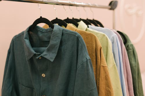 Free Variety of Long Sleeve Shirts Hanging on a Clothes Rack Stock Photo
