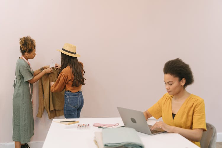 Fashion Designers Working On Clothes