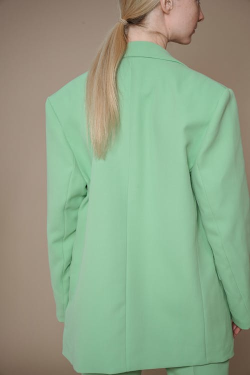 Back View of a Woman Wearing a Green Suit