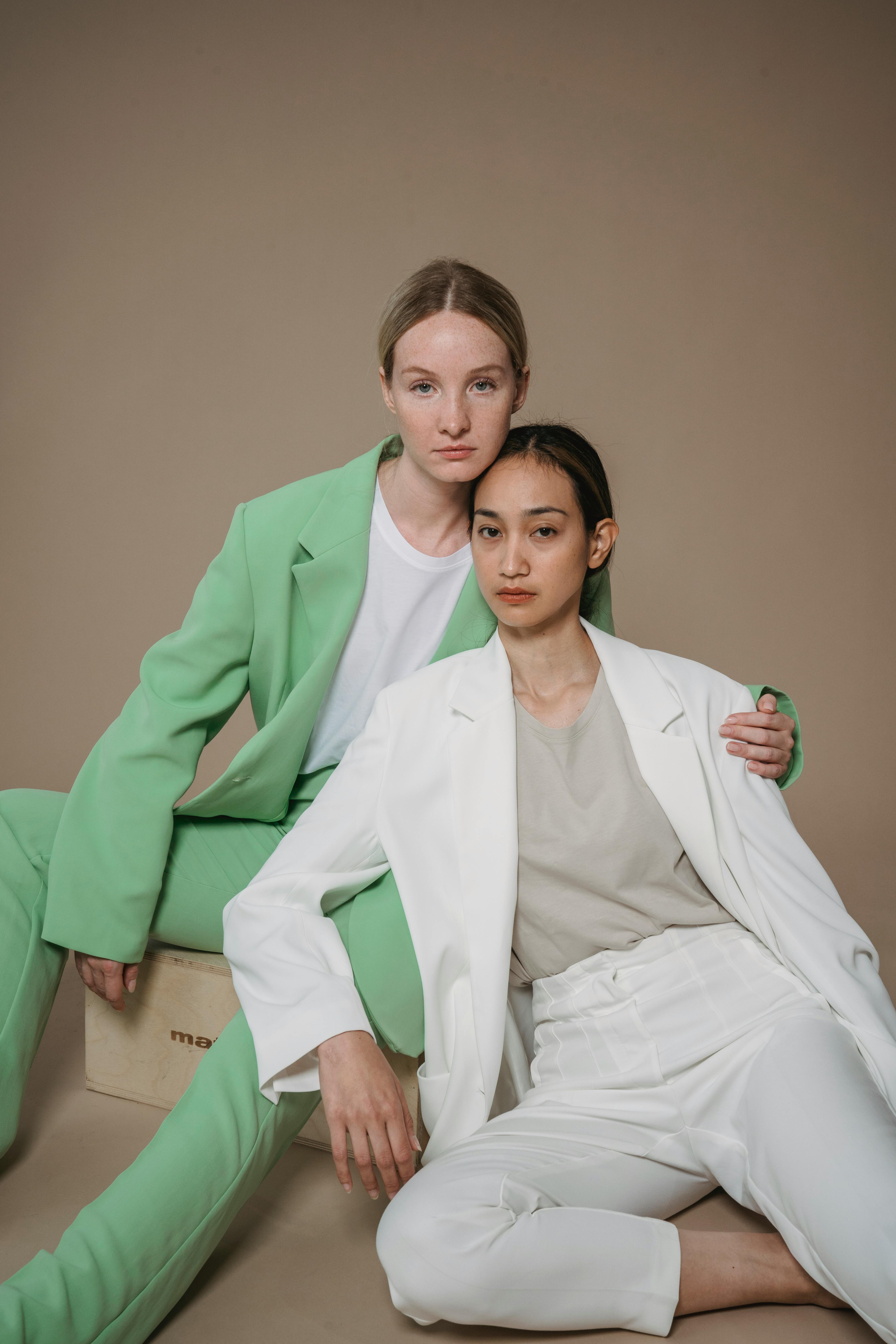 women in suits posing together