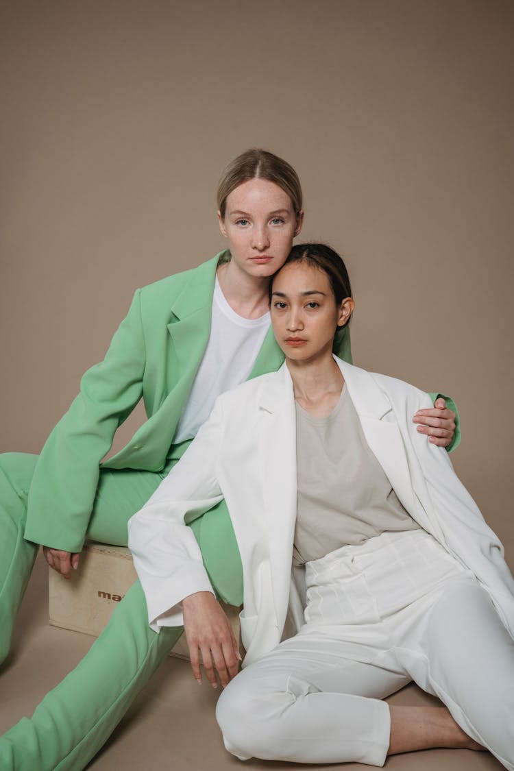 Women In Suits Posing Together