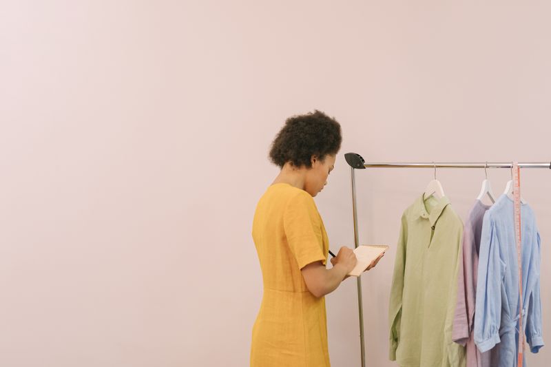 sheath dress in camel color on a mannequin