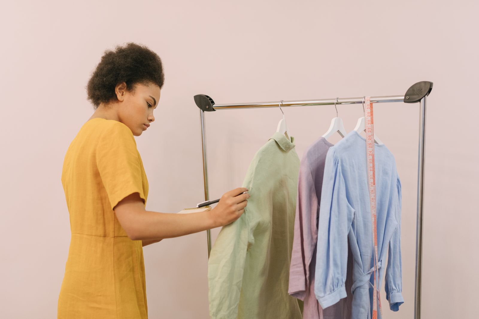 Checking finished garments on a rail