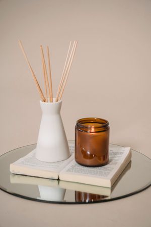 Amber jar and reed diffuser still life by Sasha Kim on Pexels