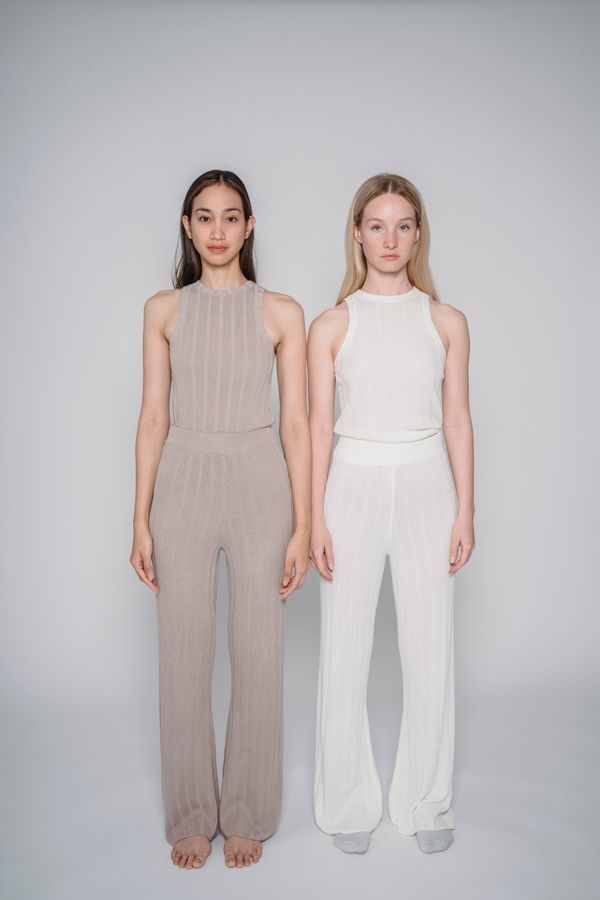 Woman wearing an elevated knit lounge set styled for the office