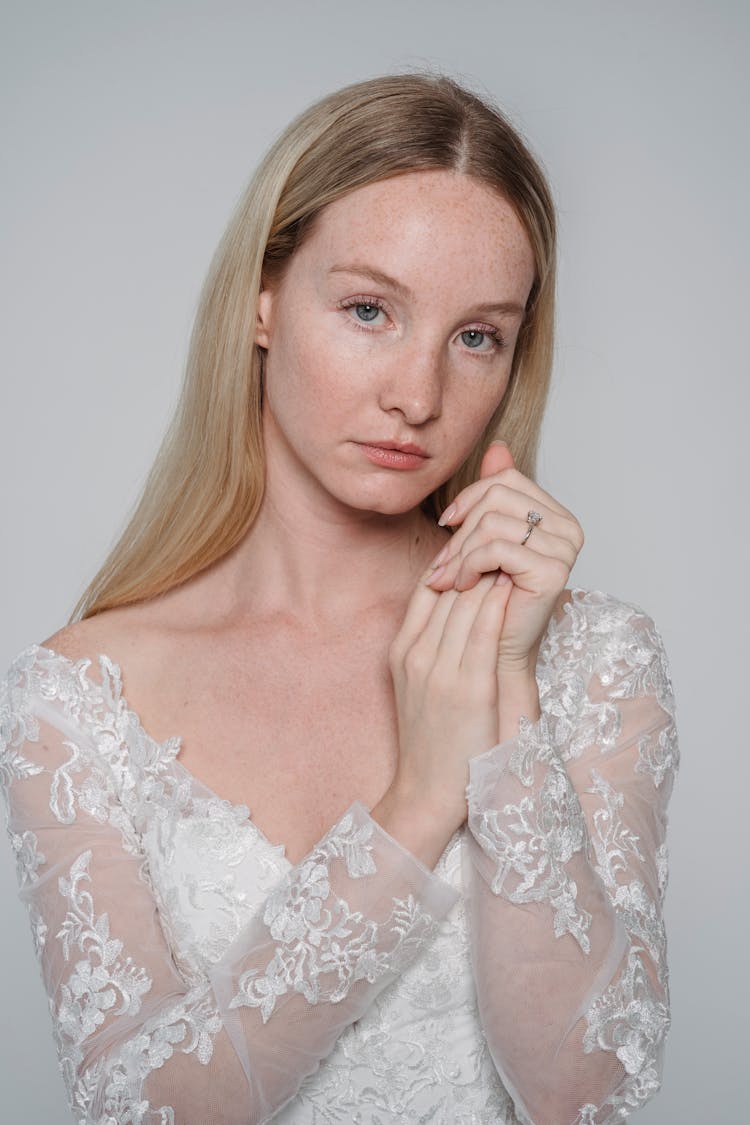 Woman In White Floral Lace Long Sleeves