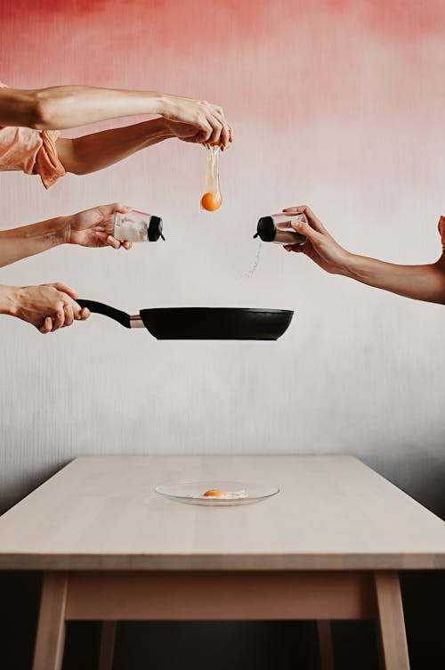 Free Painting of People Cooking a Fried Egg Stock Photo