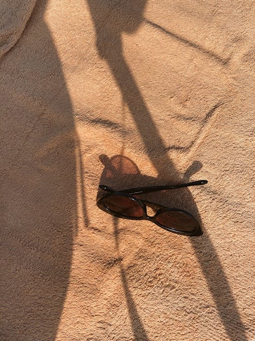 Brown Sunglasses on Brown Towel