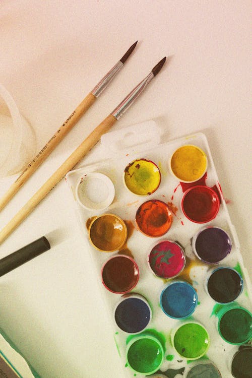 Free Watercolor Palette and Paintbrushes Stock Photo