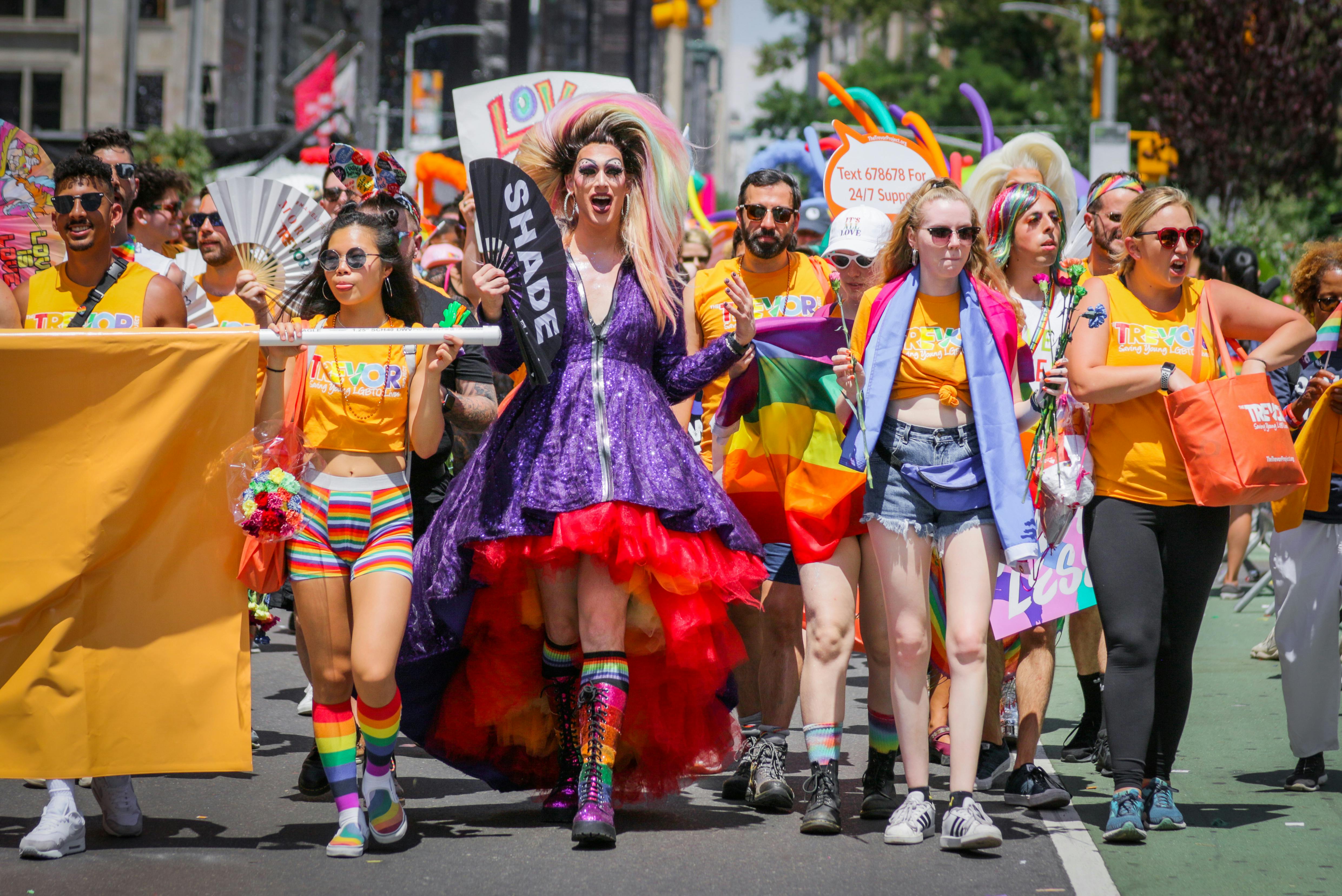 Colorful and lively NYC Pride March with diverse participants celebrating LGBTQ pride.