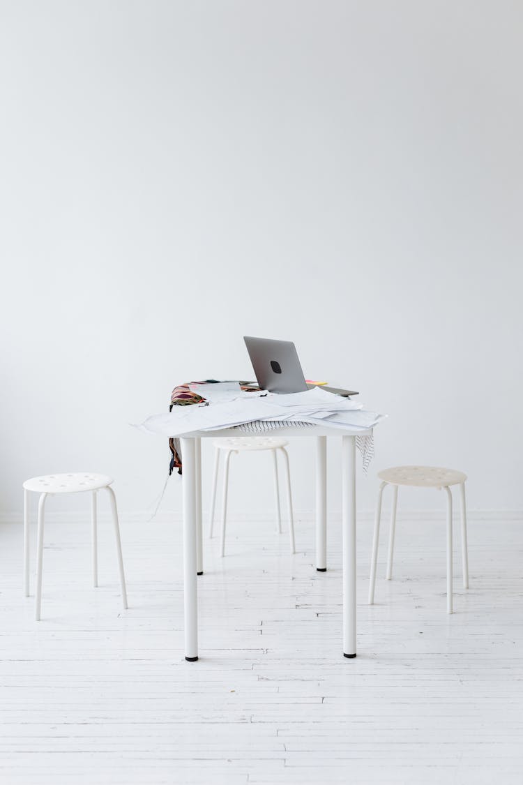 White Chairs And Table As A Workspace