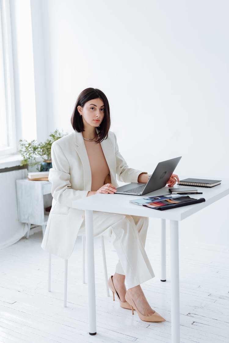 Woman In White Blazer At The Office