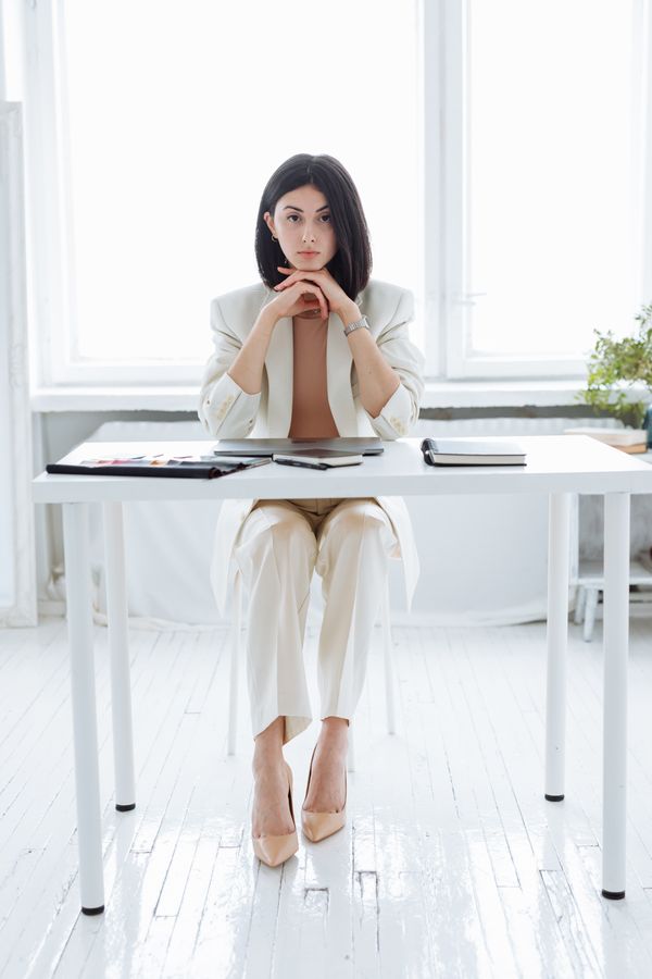 Woman in a structured midi dress for the office