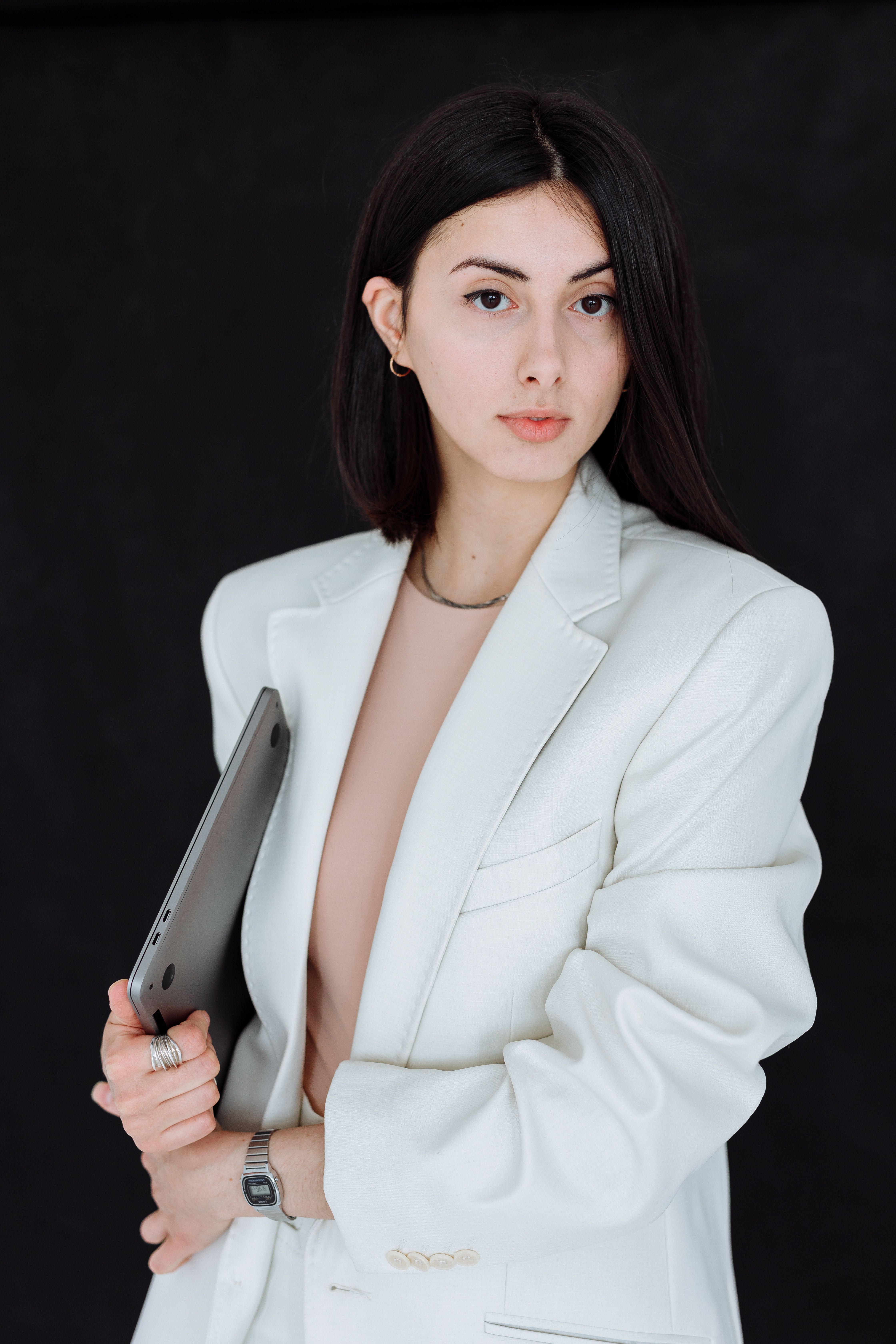 Woman in White Blazer Holding Silver Laptop · Free Stock Photo