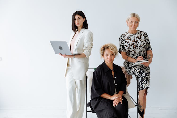 A Group Of Women Wearing Fashionable Clothes