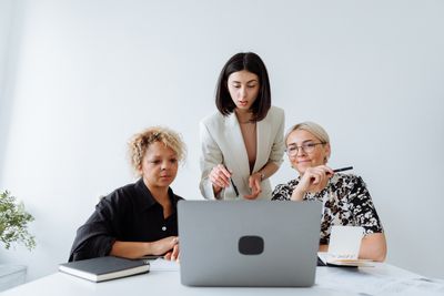 Sales team reviewing a prospect list, photo by Thirdman on Pexels