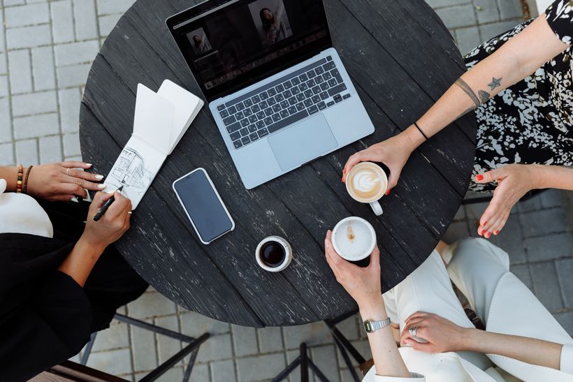 Creative meeting table with laptop and notebooks — Thirdman on Pexels