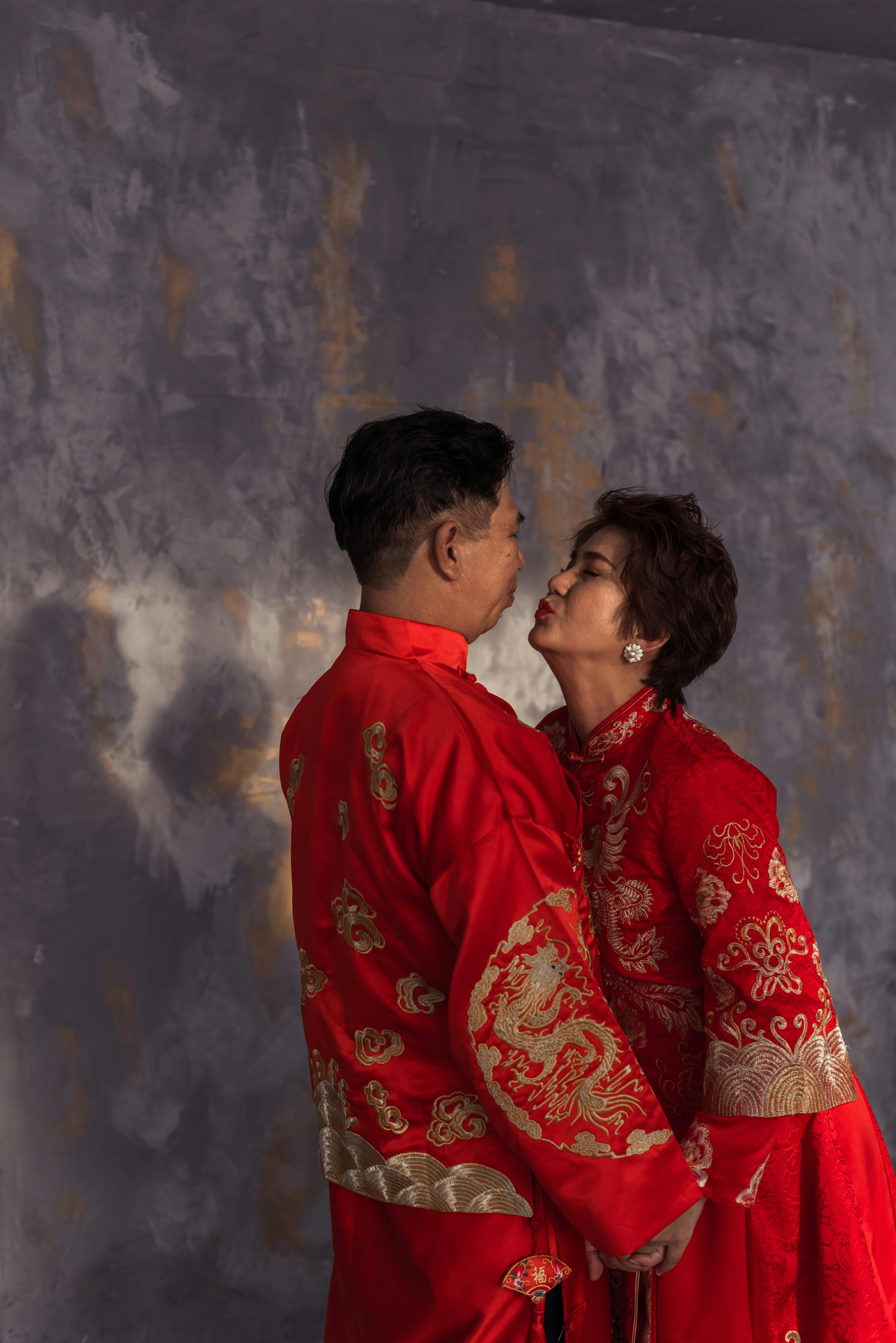 couple in traditional clothing kissing