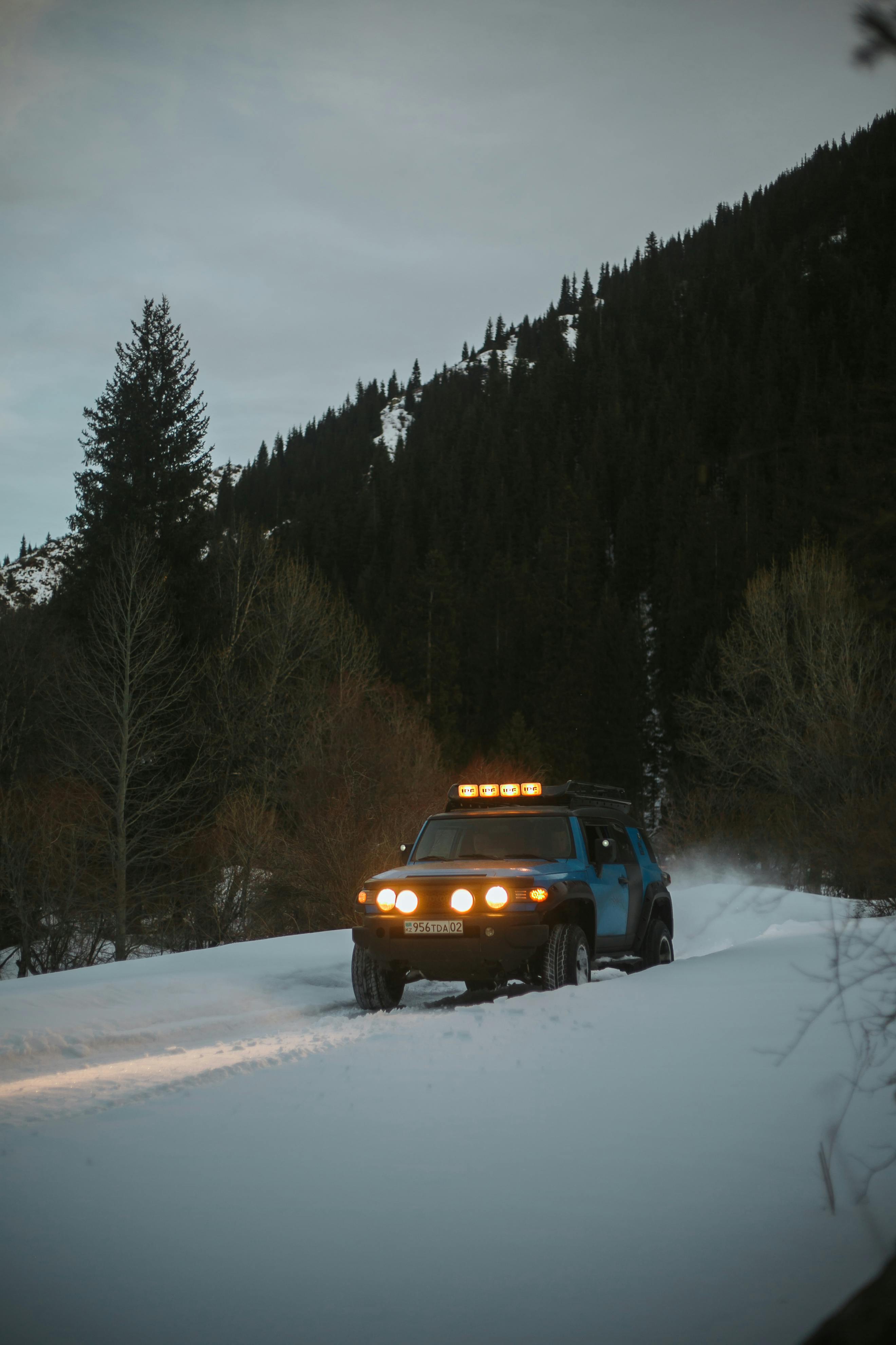 Wide shot of a ski resort with snow-covered slopes and chairlifts under a clear sky