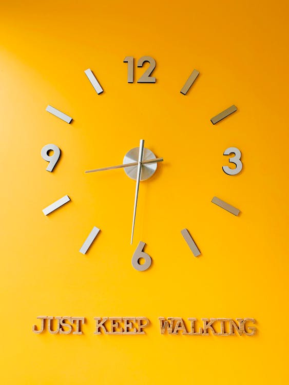 Analog Wall Clock on Yellow Wall