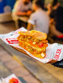 Savor the mouth-watering flavors of a grilled chicken sandwich filled with savory ingredients.