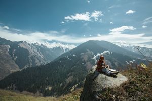 Woman in a winter mountain landscape — Visit Almaty on Pexels
