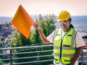 Handywoman Holding a Signal Flag