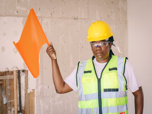 Free Woman Holding a Signal Flag  Stock Photo
