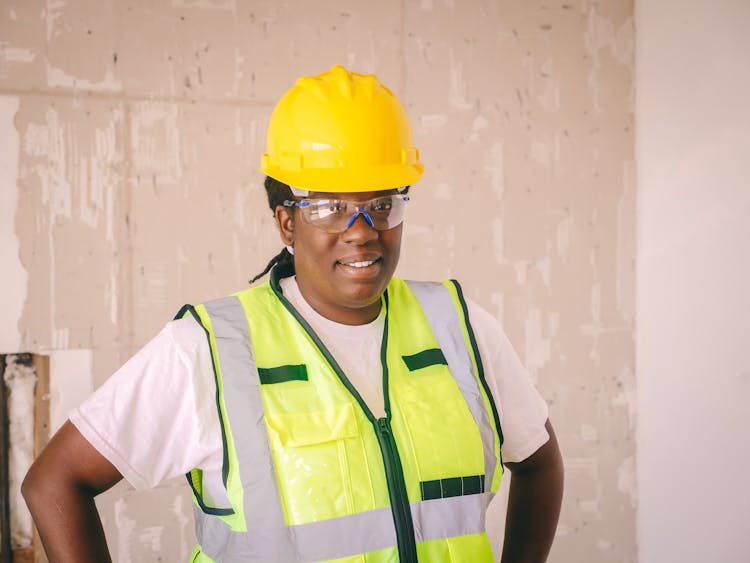 Female Engineer In Reflective Vest And Hardhat 