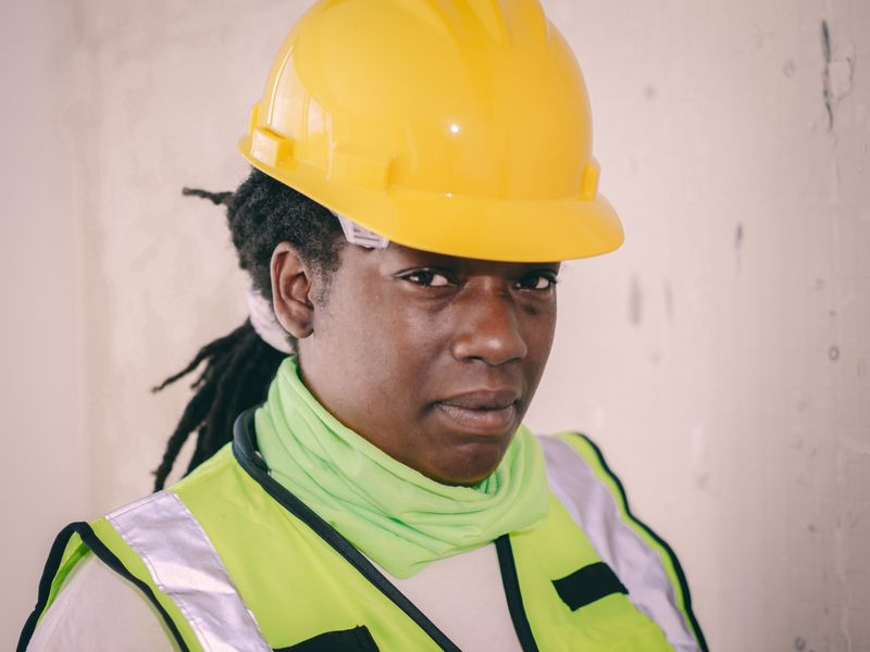 Certified engineer conducting fire door safety inspection