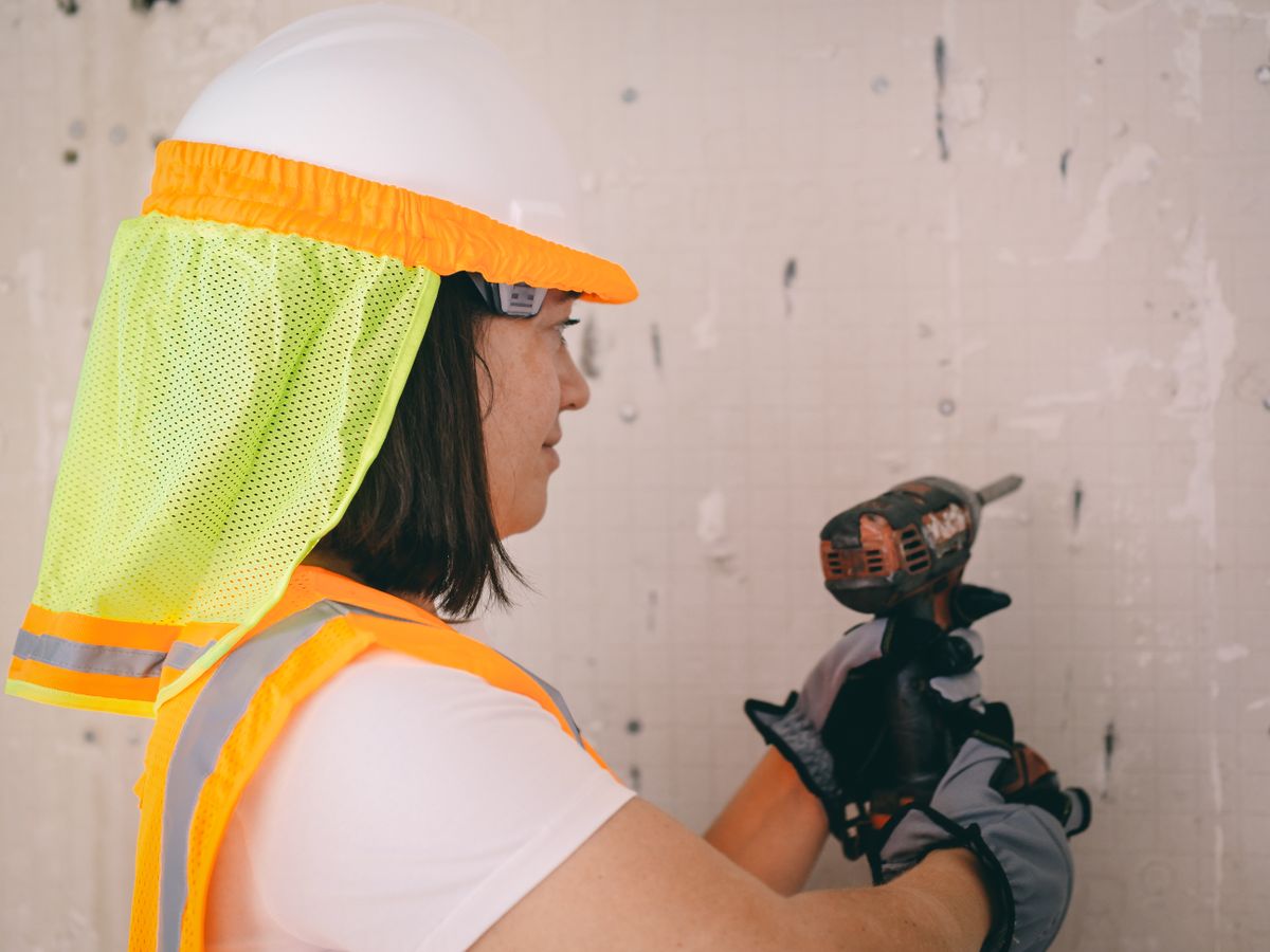 Technician working with equipment in a residential utility setting