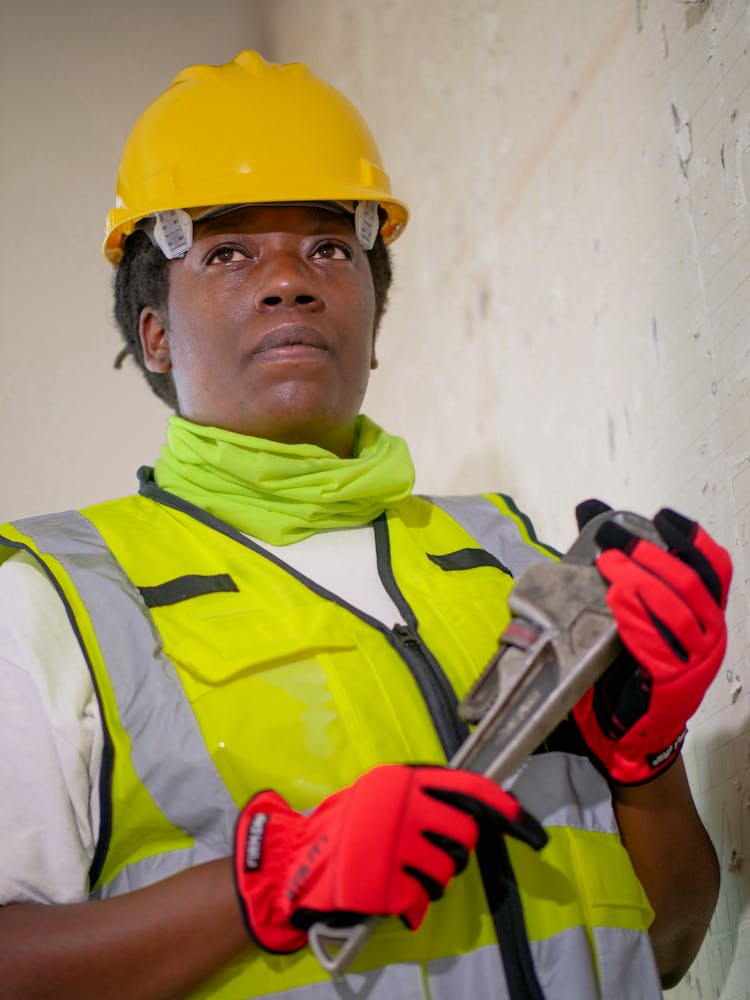 Handywoman Holding A Plumbers Wrench 