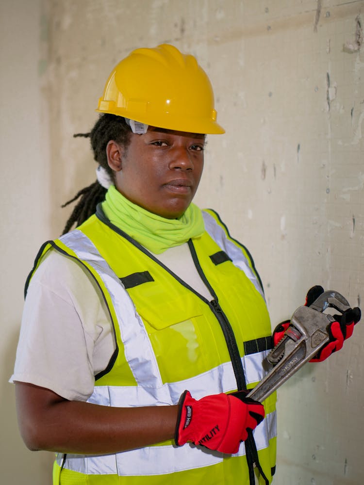 Handywoman Holding A Plumbers Wrench 