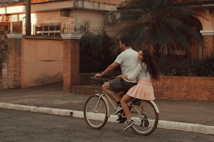  Couple Riding On A Bicycle