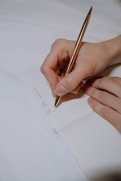 Free Person Writing a To Do List Stock Photo