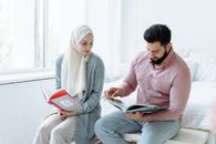 Man in Pink Dress Shirt and Woman in White Hijab