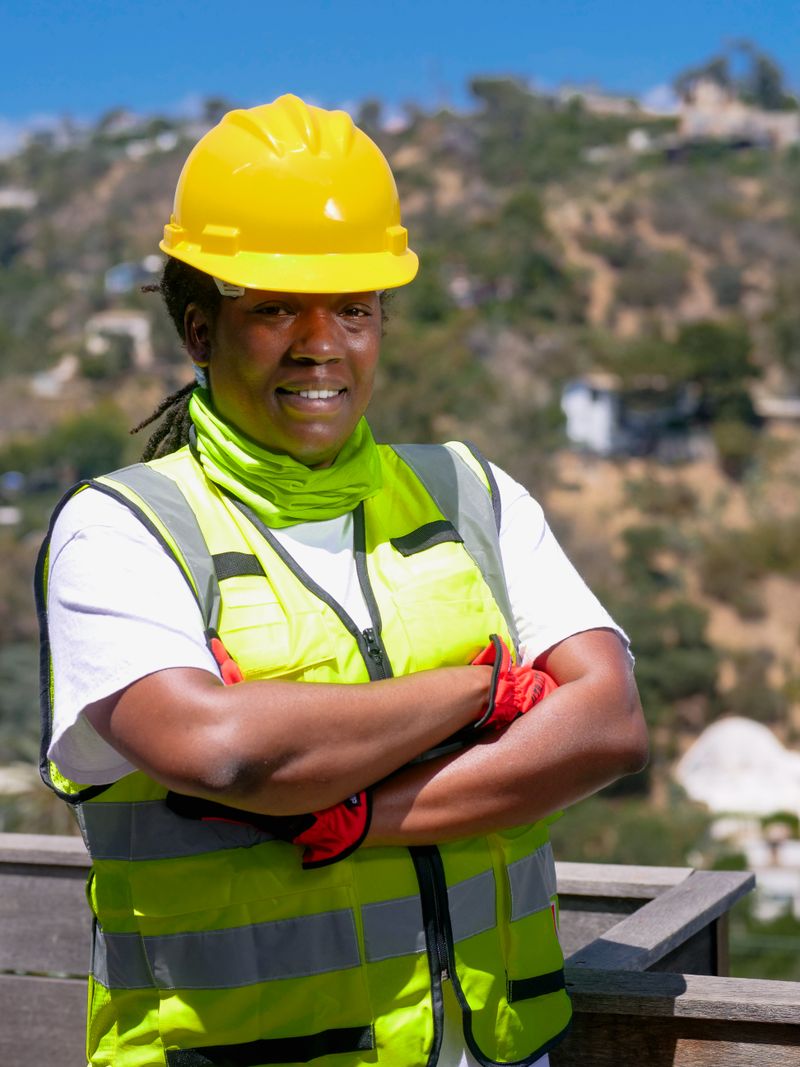 Female engineer in a reflective safety vest on a job site