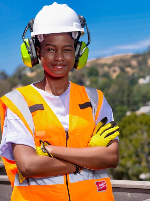 Free Handywoman in Reflective Vest and White Hardhat Stock Photo