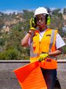 Handywoman Holding a Signaling Flag