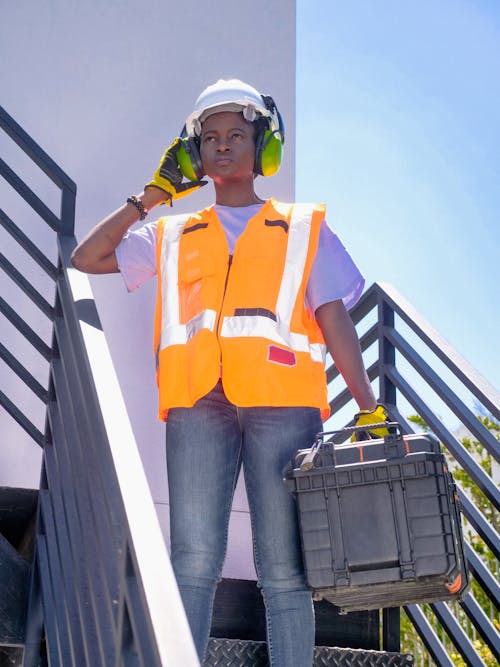 Free Female Engineer Standing on Staircase Stock Photo