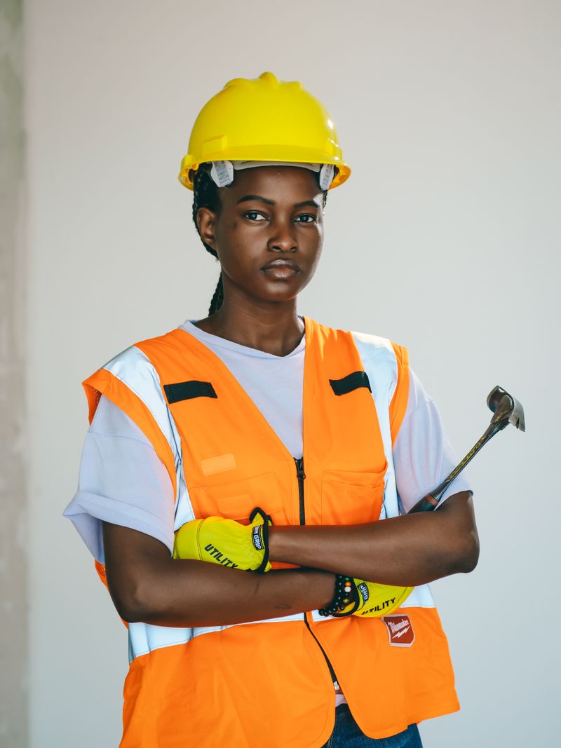 Hazel Kalim on site in a yellow hard hat and high-visibility vest